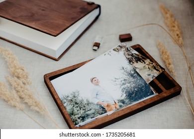 Luxury Wooden Photo Book, Wooden Box With Summer Photos Printed And Flash Card On Linen Natural Background. Family Memories Photobook. Save Your Summer Vacation Memories. Photo Album With Wooden Cover