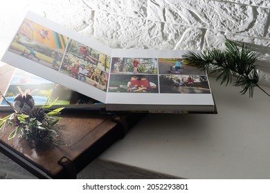 Luxury wooden photo book, wooden box with summer photos printed and flash card on linen natural background. Family memories photobook. Save your summer vacation memories. Photo album with wooden cover - Powered by Shutterstock