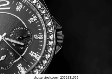 Luxury wrist watch full of diamonds on black with copy space. Analog wrist watch close up picture. Time limit. - Powered by Shutterstock