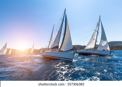 Luxury yachts at Sailing regatta. Sailing in the wind through the waves at the Sea.  - Shutterstock ID 357306383