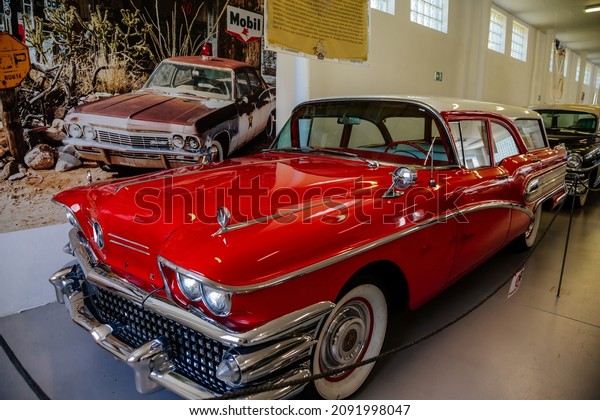 Luzna, Czech\
Republic, 31 July 2021:  Vintage old historic cars displayed at\
Classic Automobile Museum of American veterans JK Classics, red\
1958 buick caballero estate wagon, Route\
66