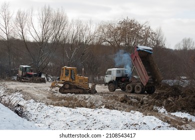 Lviv, Ukraine - 01.12.2022: The Process Of Planning And Leveling The Construction Site With Heavy Machinery. Earthworks At The Initial Stage Of Construction