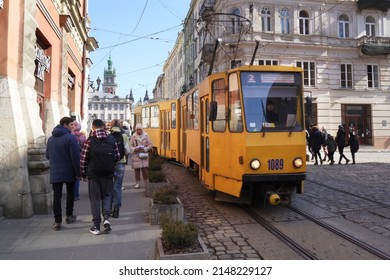 Lviv Ukraine - 03 20 2022: Tram Of Lviv Public Transport In Ancient City Center Near Market Square Beautiful Yellow Tram Historic Center Of Lviv Ukrainian Town, Outdoors