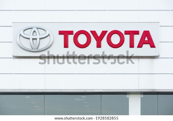 Lviv, Ukraine - 03.02.2021: The advertising sign\
with Toyota logo on the\
facade