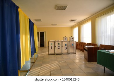 Lviv, Ukraine, 19 July 2019. Ukraine Local Elections 2020. A Dog Is Seen At Empty Polling Boxes At Polling Station. 