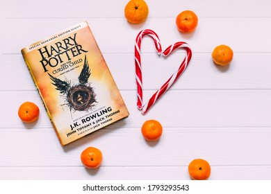 Lviv, Ukraine - 20 December, 2017. Harry Potter And The Cursed Child. Top View Of The Bestseller Book Sugar Candy And Tangerines.