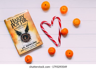 Lviv, Ukraine - 20 December, 2017. Harry Potter And The Cursed Child. Top View Of The Bestseller Book Sugar Candy And Tangerines.