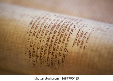 LVIV, UKRAINE - April 3, 2020: Old torah scroll book close up detail. Torah Jewish People. Shallow depth of field