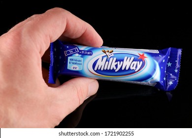 LVIV, UKRAINE - April 30, 2020: Milky Way chocolate bar in hand