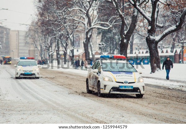 Lviv, Ukraine - December 16, 2018: police car on\
Lviv street in winter