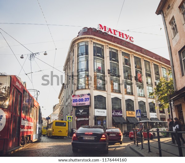 Lviv, Ukraine\
- July 3, 2018: View of the Mahnus Mall from the busy Horodotska\
Street in the center of Lviv in the evening hours. It is the\
typical older shopping mall in\
Ukraine
