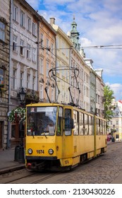 LVIV, UKRAINE - JULY 4, 2021: Old Yellow Tram Is In The Historic Center Of Lviv. City Electric Transport. 