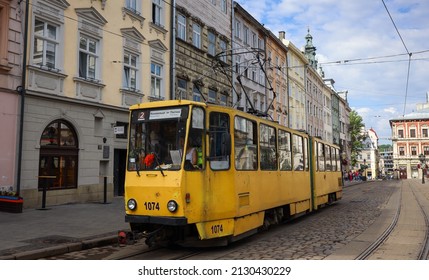 LVIV, UKRAINE - JULY 4, 2021: Old Yellow Tram Is In The Historic Center Of Lviv. City Electric Transport. 