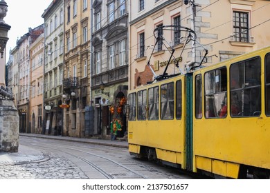 LVIV, UKRAINE - JULY 4, 2021: Old Yellow Tram Is In The Historic Center Of Lviv. City Electric Transport. 