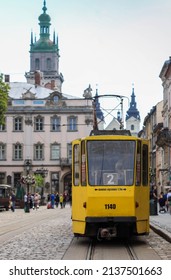 LVIV, UKRAINE - JULY 4, 2021: Old Yellow Tram Is In The Historic Center Of Lviv. City Electric Transport. 