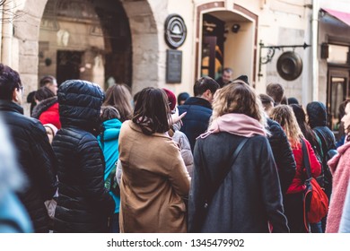 Lviv. Ukraine. March 15, 2019: People Quest In Line Up, Dragged In A Urban Setting Queue Of People