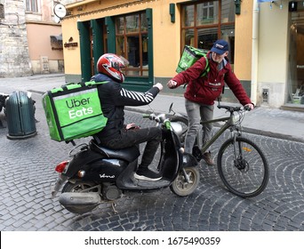 Lviv, Ukraine - March 17, 2020: A Deliverymen For Uber Eats In Center Of Lviv.