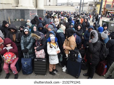 Lviv, Ukraine - March 6, 2022: Refugees near railway station of Lviv waiting for the train to Poland.