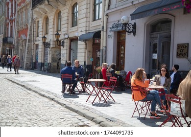 Lviv, Ukraine - May 21, 2020:  Lviv Streets During COVID-19 Quarantine. Lviv Major Andriy Sadovyi In Outdoor Cafe