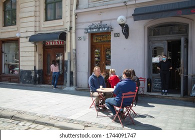 Lviv, Ukraine - May 21, 2020:  Lviv Streets During COVID-19 Quarantine. Lviv Major Andriy Sadovyi In Outdoor Cafe