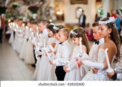 LVIV, UKRAINE - MAY 8, 2016: The Ceremony Of A First Communion In The Church Of St. Peter The Great Of Ukrainian Greek Catholic Church. 