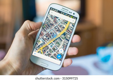 LVIV, UKRAINE - Sept 09, 2015: Hand Holding White Samsung Smart Phone With Google Map Application