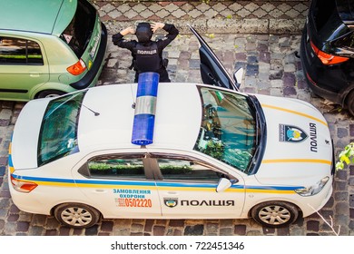 Lviv, Ukraine  - September 16, 2017: Policeman Near Police Car. Aerial View