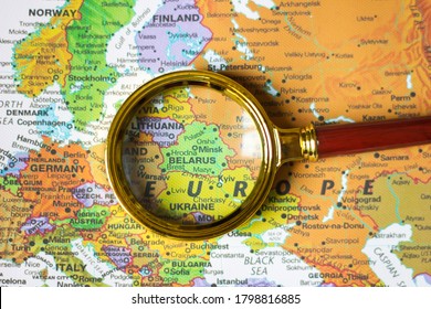 Lviv/Ukraine-14 08 2020:Belarus, Minsk on the map of Europe a defocused magnifying glass, the theme of travel and trips Belarus, Minsk, Gomel, Brest, Grodno, and other cities of Belarus
