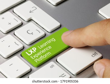 LXP Learning Experience Platform Written On Green Key Of Metallic Keyboard. Finger Pressing Key.