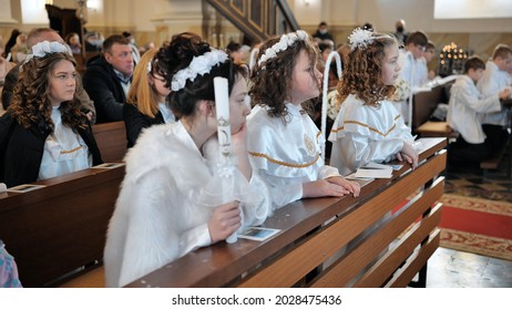 Lyadsk, Belarus - May 2, 2021: The First Communion Of Children In A Catholic Church.