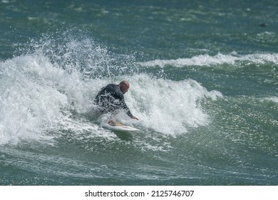 Lyall Bay, Wellington, New Zealand,  January 27, 2022.  Surfing The Storm Break,