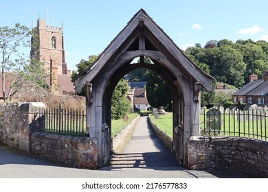 The Lych Gate Of St George Priory Church In Dunster, Somerset. It Marks The Start Of Consecrated Ground And Traditionally Pall Bearers Would Lay The Coffin Here And The Priest Would Start The Service