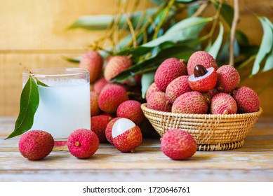 Lychee Juice On Wooden Table / Fresh Lychee Drink And Slice Peeled With Green Leaves Harvest In Basket From Tree Tropical Fruit Summer In Thailand 