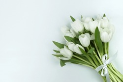 Lying Bouquet Of White Tulips With A White Bow On The Right Of The Picture, White Background, Free Space On The Left, Horizontal
