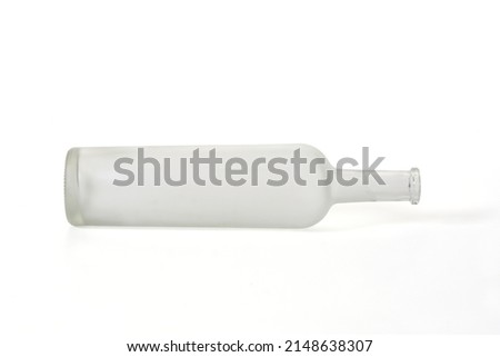 lying down of a opaque glass bottle isolated on white background
