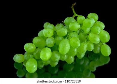 lying grapes with black background