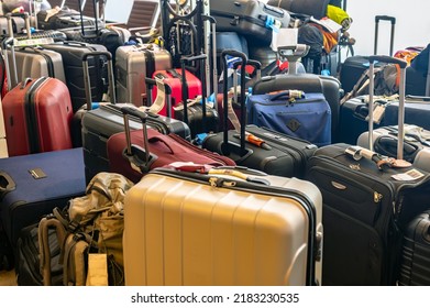 Lying luggage at an airport as an effect of the staff shortage of the ground personnel - Shutterstock ID 2183230535