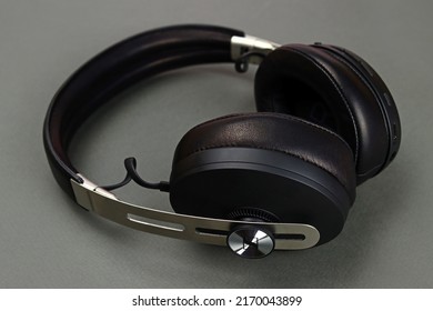 Lyman, Ukraine - January 17, 2022: SENNHEISER Momentum 3 wireless headphones with noise reduction on a gray background