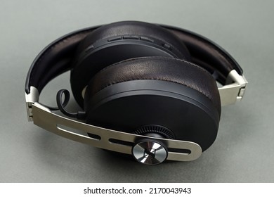 Lyman, Ukraine - January 17, 2022: SENNHEISER Momentum 3 wireless headphones with noise reduction on a gray background