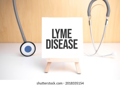 Lyme Disease Sign On Small Wood Board Rest On The Easel With Medical Stethoscope