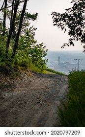 LYNCHBURG, UNITED STATES - Jul 21, 2021: A vertical shot of Liberty University in Lynchburg, Virginia from LU monogram hiking trail, haze covering the city from the west coast forest fires