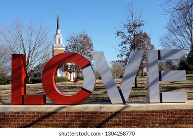 Lynchburg, Virginia / USA - February 4, 2019: A "Virginia is for lovers" reminder sculpture in front of the Lynchburg University chapel.  
