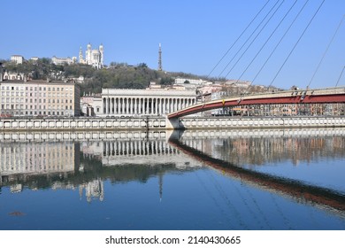 Lyon Courthouse with the Basilica of Notre Dame de Fourvière in the background and the footbridge of the courthouse in front