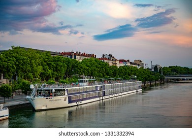 Lyon, France - 6/8/2015:  A River Cruise Boat Docked Along The Rhone River In Lyon, France