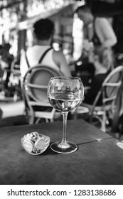 Lyon, white wine in a cafe terrace in Croix rousse - France. Black and white pic