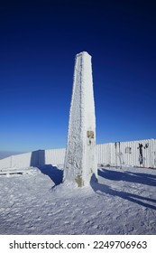 Lysa hora, Beskid mountains, Czech Republic, Czechia - landmark, monument and obelisk on the top of mountain. Winter and wintertime with white snow and clear blue sky. Heavy vignetting. - Shutterstock ID 2249706963