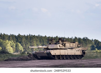 M1 Abrams tank in use during the war in Ukraine, showcasing modern military technology and battlefield deployment.