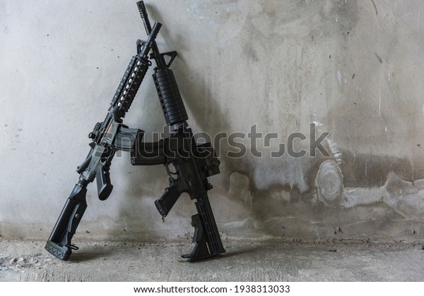 The m16 gun is\
placed in a dilapidated\
room