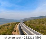 The M6  motorway Expressway Nakhon Ratchasima Province - Bang Pa-in. Lam Ta Khong River and Mountain. Drone shot of scenic landscape rural place traffic. Nakhon Ratchasima Thailand. Motorway Korat