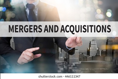 M&A (MERGERS AND ACQUISITIONS) And Businessman Working With Modern Technology